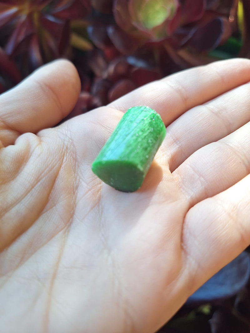 A piece of the candy in the palm of a hand
