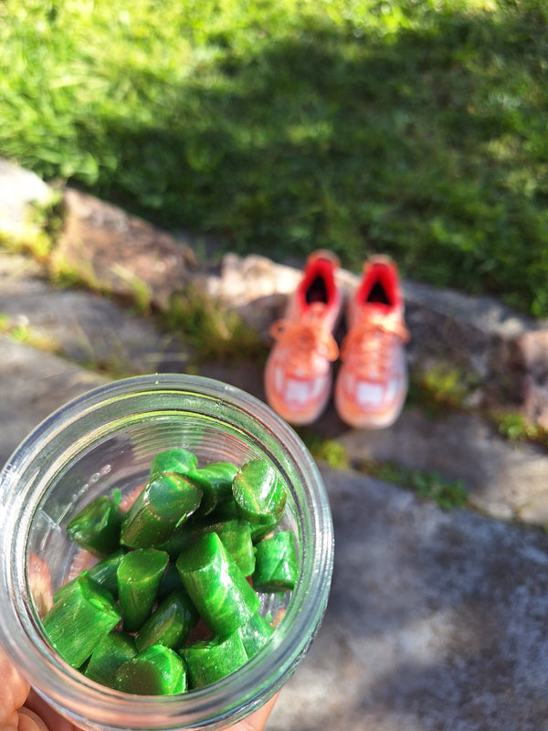 A jar of the candy outdoors, ready for a run